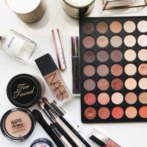 Foundation, eye shadow, and eye liner on a table